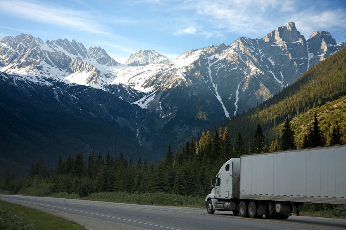 A semi-truck on a mountain highway illustrating trucking litigation risk